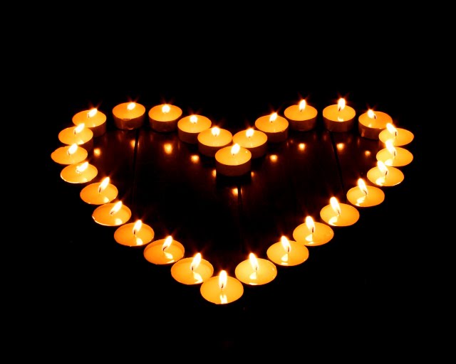 A heart shape made from candles